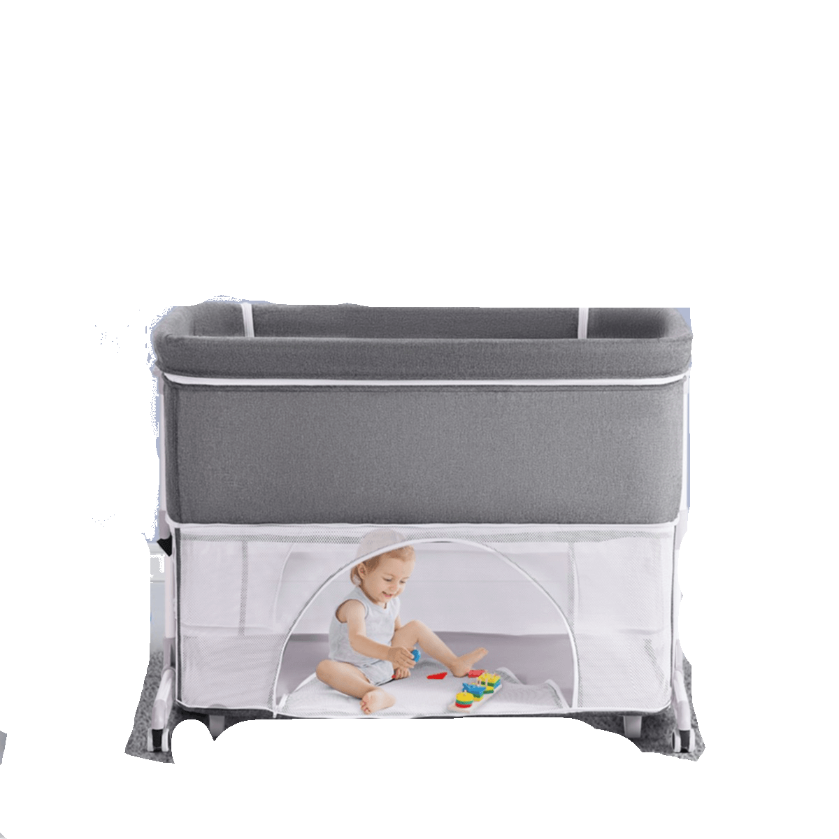 Cuna de bebé junto a la cama